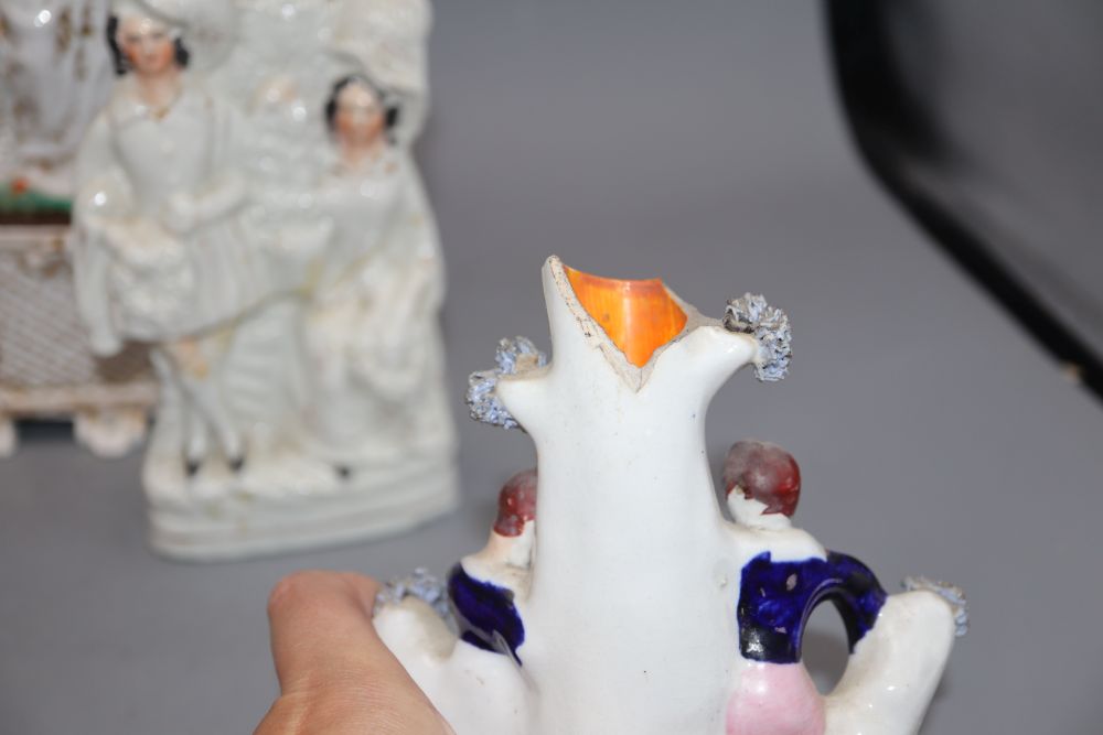 Three Victorian Staffordshire pottery groups and a French porcelain figure, tallest 28cm